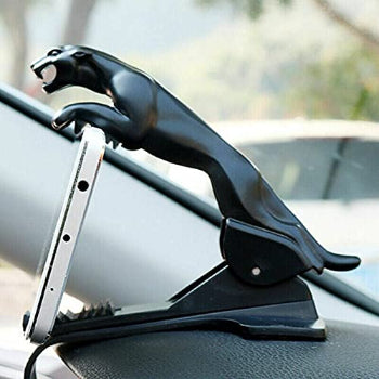 Black panther car dashboard phone holder and decorative ornament with a smartphone securely clipped in