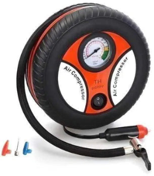 Air compressor with gauge and attachments on a white background