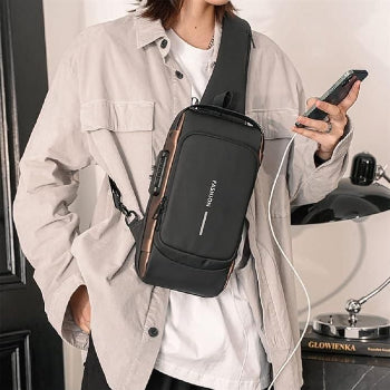 Person wearing a black crossbody bag with 'FASHION' branding, holding a phone.